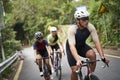 young asian people cycling on rural road Royalty Free Stock Photo