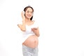 Young Asian pregnant women happy smiling listening music