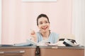 Young asian pretty woman traveler prepare checking and packing clothes into suitcase for holiday vacation at home Royalty Free Stock Photo