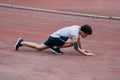 Young Asian runner injury and lying down on track during running. Accident sport concept.