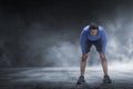 Young asian runner man taking rest from jogging Royalty Free Stock Photo