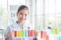 Young girl standing and smiles in chemistry classroom,education concept