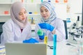 Young Asian scientist with test tube making research in clinical laboratory,Science Royalty Free Stock Photo