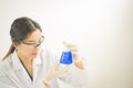 Young Asian scientist working in the lavatory with test tubes and other equipment to discover new drugs Royalty Free Stock Photo