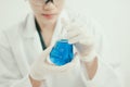 Young Asian scientist working in the lavatory with test tubes and other equipment to discover new drugs Royalty Free Stock Photo