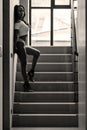 Young asian sportive woman posing in bikini on stairs