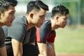 Young asian sprinters on starting line Royalty Free Stock Photo