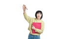 Young asian student woman raising her hand to ask a question, isolated. Royalty Free Stock Photo