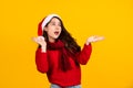 Young Asian surprised and shocked. Asian woman wear Santa Claus Christmas red hat spread hands Royalty Free Stock Photo