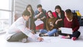 Young asian teen group meeting discuss or brainstorm business strategy doing project in modern office.