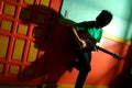 Young asian teen playing the guitar in a living room Royalty Free Stock Photo