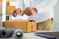 Young asian teenage product owners are packing small business packaging products in boxes prepared for shipping Royalty Free Stock Photo