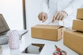 Young asian teenage product owners are packing small business packaging products in boxes prepared for shipping Royalty Free Stock Photo