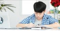 Young asian teenage student doing homework . Royalty Free Stock Photo