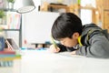 Young asian teenage student doing homework . Royalty Free Stock Photo