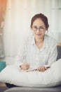 Young asian teenage student doing homework . Royalty Free Stock Photo