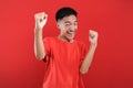 Young Asian teenager doing winning gesture, Happy get special gift