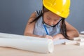 Young asian Thai girl kid in yellow safety helmet Royalty Free Stock Photo