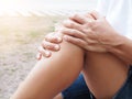 Asian Thai women with body aches suffering muscle injury with knee pain and leg pain