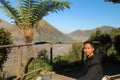 A young Asian tourist in the morning sun at the Bromo caldera. Bromo Volcano Sunrise Landmark Nature Travel Place Of