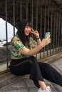 Young Asian tourist woman taking a selfie with her smartphone. Royalty Free Stock Photo