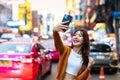 Young Asian tourists standing selfie taking a photo