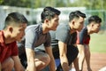 Young asian sprinters on starting line Royalty Free Stock Photo