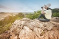 Young Asian traveler woman looking a binoculars. Royalty Free Stock Photo