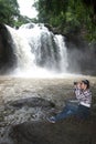 Young Asian traveler woman looking a binoculars. Royalty Free Stock Photo