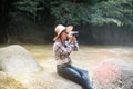 Young Asian traveler woman looking a binoculars. Royalty Free Stock Photo