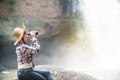 Young Asian traveler woman looking a binoculars. Royalty Free Stock Photo