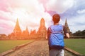 Young asian traveling backpacker in temple Ayuttaya, Thailand