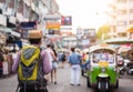 Young Asian traveling man walking in Khaosan Road walking street at Bangkok Royalty Free Stock Photo