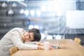 Young Asian university student take a nap in library Royalty Free Stock Photo