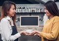 Young asian woman barista hold coffee cup serving a client at the coffee shop,start up small business owner food and drink concept Royalty Free Stock Photo