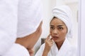 Young asian woman with bath towels cleanses her face Royalty Free Stock Photo