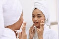 Young asian woman with bath towels cleanses her face Royalty Free Stock Photo