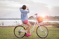 young asian woman on bicycle look at hand frame view