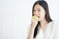 Young Asian woman bite green apple show Strong teeth. Royalty Free Stock Photo