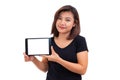 Young asian woman black hair holding tablet computer. Woman using blank screen digital tablet computer Royalty Free Stock Photo