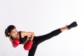 Female boxer doing high kick Royalty Free Stock Photo