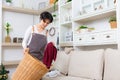 Young asian woman boring doing laundry at living room Royalty Free Stock Photo
