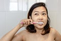 Young  asian woman brushing teeth in the morning,with healthy teeth concept Royalty Free Stock Photo