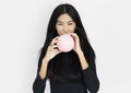 Young asian woman casual blowing a balloon