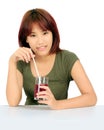 Young asian woman with a cglass of grape juice