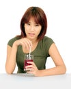 Young asian woman with a cglass of grape juice Royalty Free Stock Photo