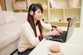 Young asian woman chatting with laptop Royalty Free Stock Photo