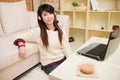 Young asian woman chatting with laptop Royalty Free Stock Photo