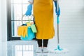 Young asian woman cleaning house Sweeping the floor with a mop House keeping concept Royalty Free Stock Photo