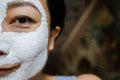 Asian Woman With Cleansing Mask On Her Face At Home. Skin Care. Royalty Free Stock Photo